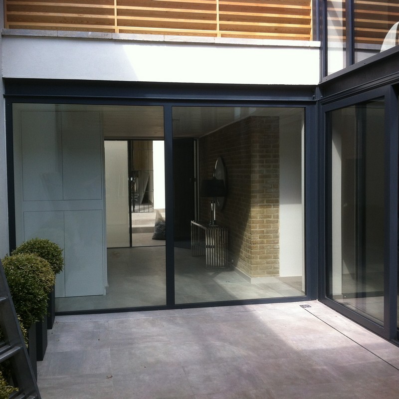 Floor-to-ceiling sliding doors opening to courtyard in Bayswater