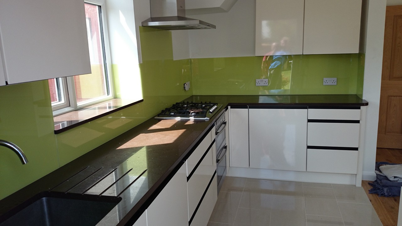 Lime green glass kitchen splashback installed by Bayswater glaziers