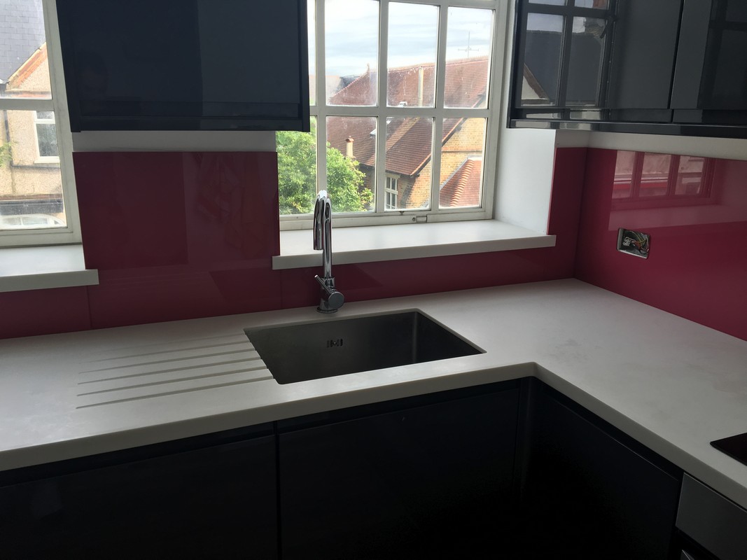 Deep plum coloured glass splashback in modern Bayswater kitchen